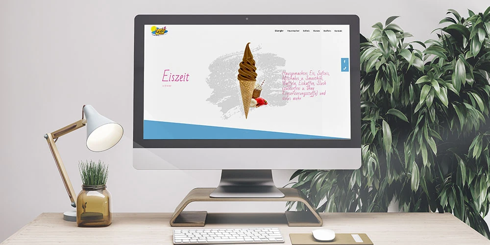 Website der Eismanufaktur Eisangler auf einem Monitor mit Eistüte